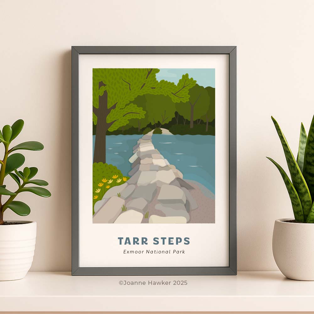 Framed, illustrated print of Tarr Steps in Exmoor National Park on a wall with plants.