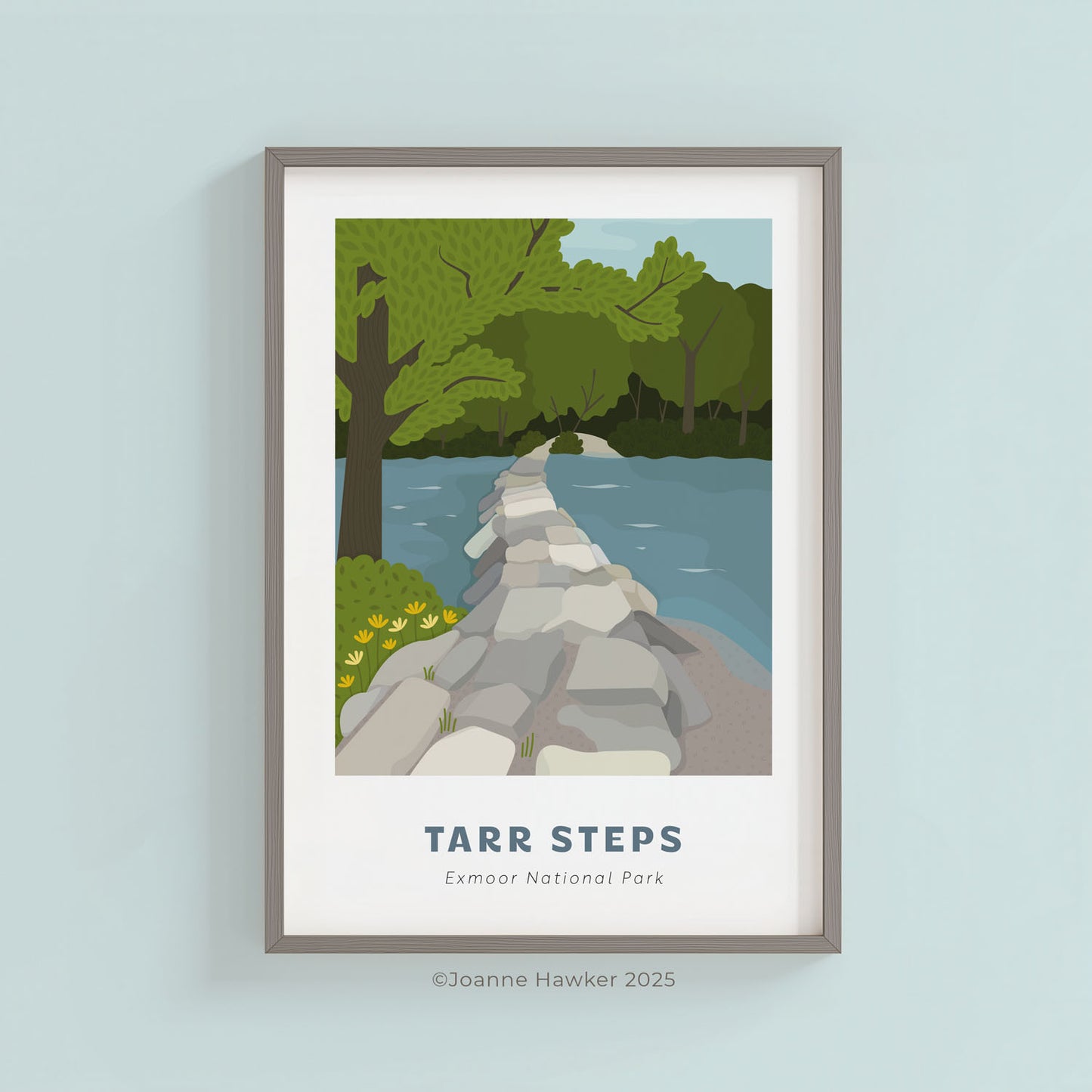 Framed artwork of Tarr Steps in Exmoor National Park on a light blue wall.