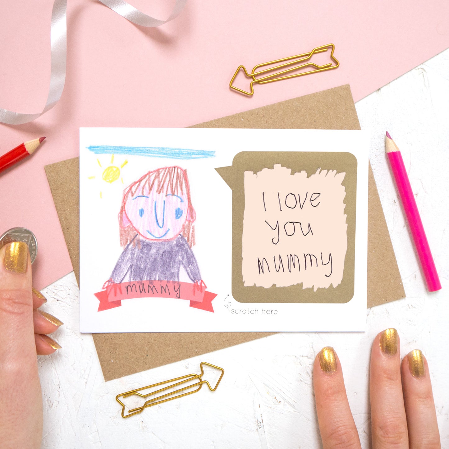 Draw your own scratch card with a hand written message of 'i love you mummy'. The card features a child like drawing of a person and the panel has been scratched off to reveal a hand written message.