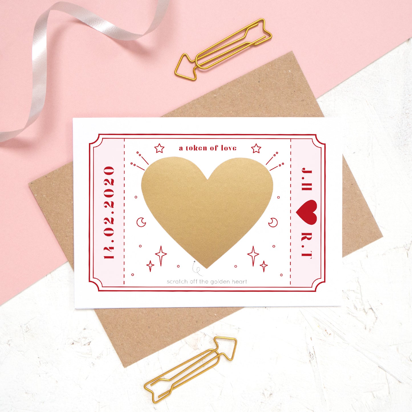 The personalised Love token scratch card after the personalised message has been covered with the gold scratch panel.