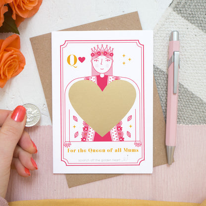 For the queen of all mums! A scratch card by Joanne Hawker featuring a bright pink queen and the gold heart after it has been applied and before it is scratched off.