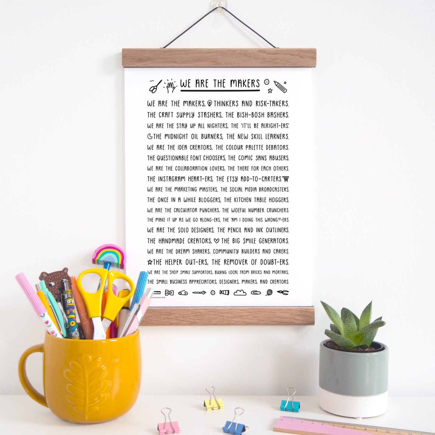 We are the makers rhyming print about what it means to be a maker in black and white, displayed in an oak magnetic frame which is available as an add on purchase.