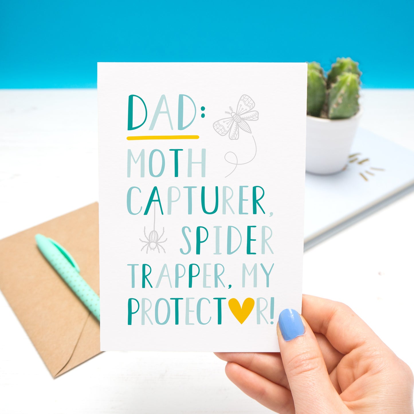 'Dad: Moth capturer, spider trapper, my protector.' - a typographic card in shades of blue with an illustrated, grey, moth and spider.