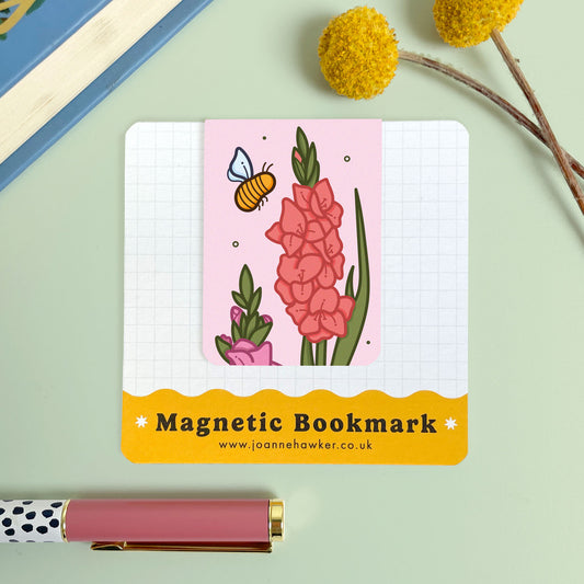Magnetic bookmark with floral gladiolus design and bee illustration on a light green background