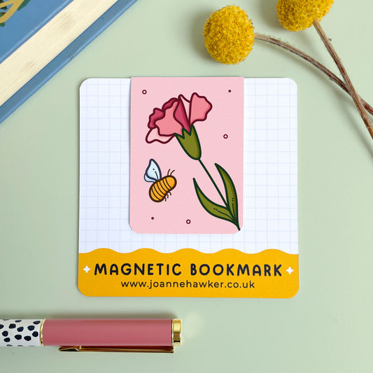 Magnetic bookmark with a floral carnation design and brand information on a light green background