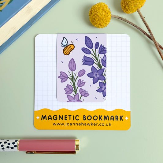 Magnetic bookmark with floral larkspur design and bee illustration on a light green background