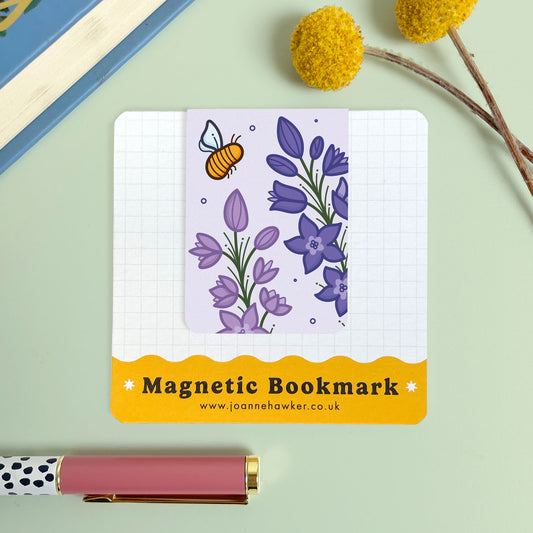 Magnetic bookmark with floral larkspur design and bee illustration on a light green background