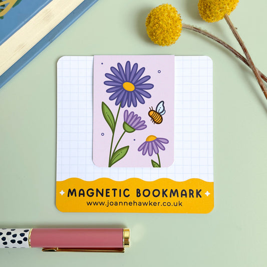 Magnetic bookmark with floral aster design on a light green background