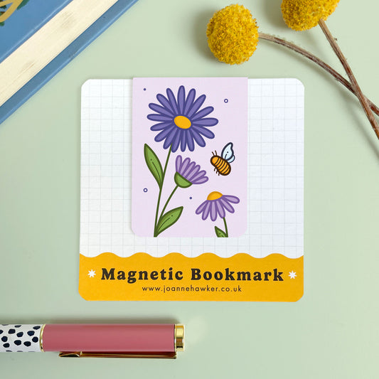 Magnetic bookmark with floral aster design on a light green background