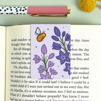 Floral illustrated larkspur bookmark with a bee on an open book