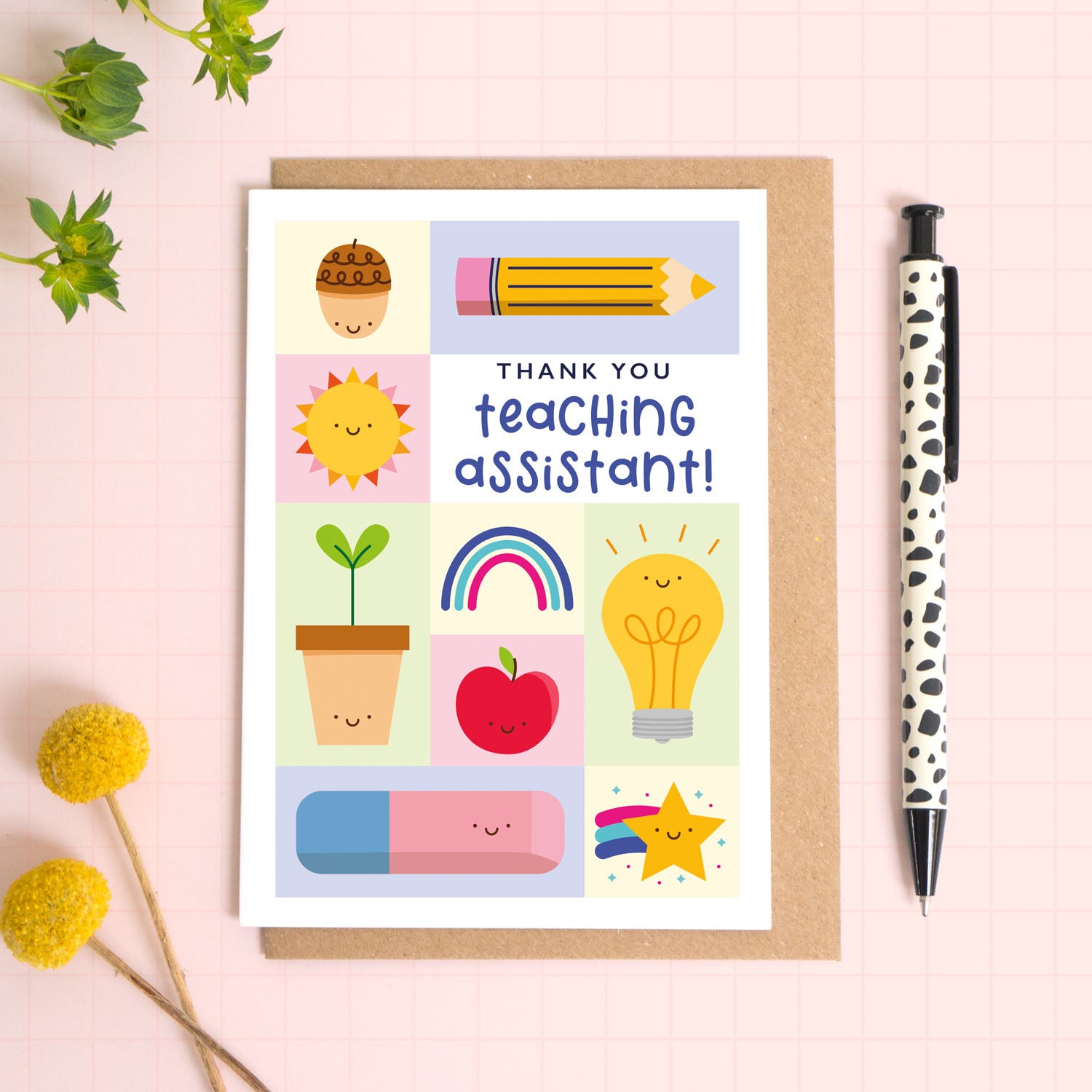 Thank you teaching assistant card with a kraft brown envelope. This teaching assistant thank you card features a variety of happy school related objects including an acorn, pencil, growing seed, apple and an eraser. The perfect card for primary school teaching assistants.