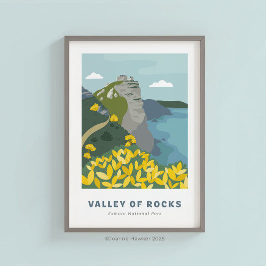 Framed, illustrated A4 print of Valley of Rocks in Exmoor National Park on a light blue wall.
