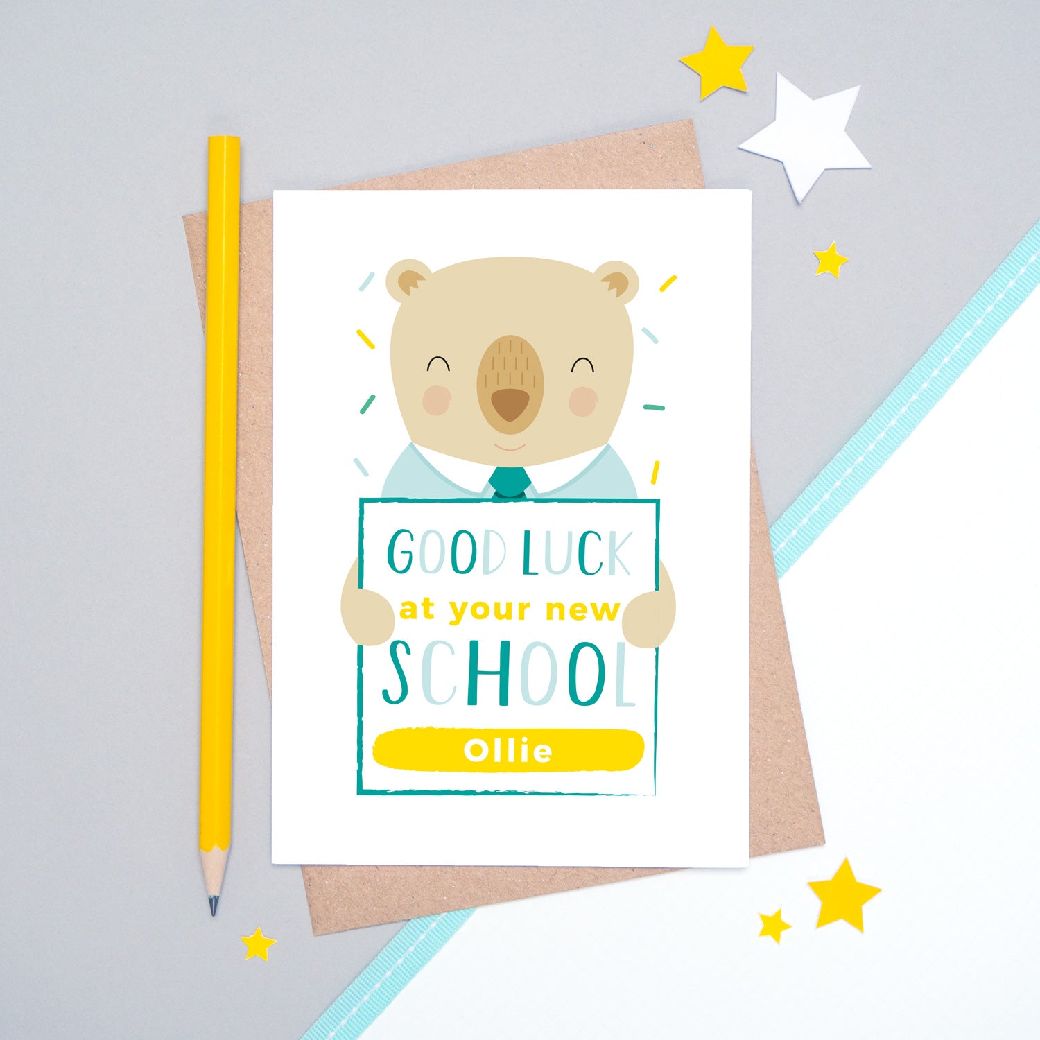A good luck at your new school personalised card featuring a friendly bear sat on a grey and white background.
