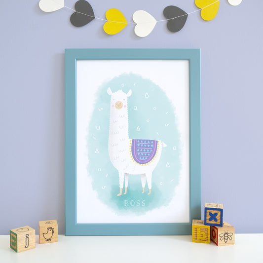 A personalised Llama print that features the name of a child. The white slightly textured llama is set upon a blue water colour background and is wearing a purple and pink blanket.