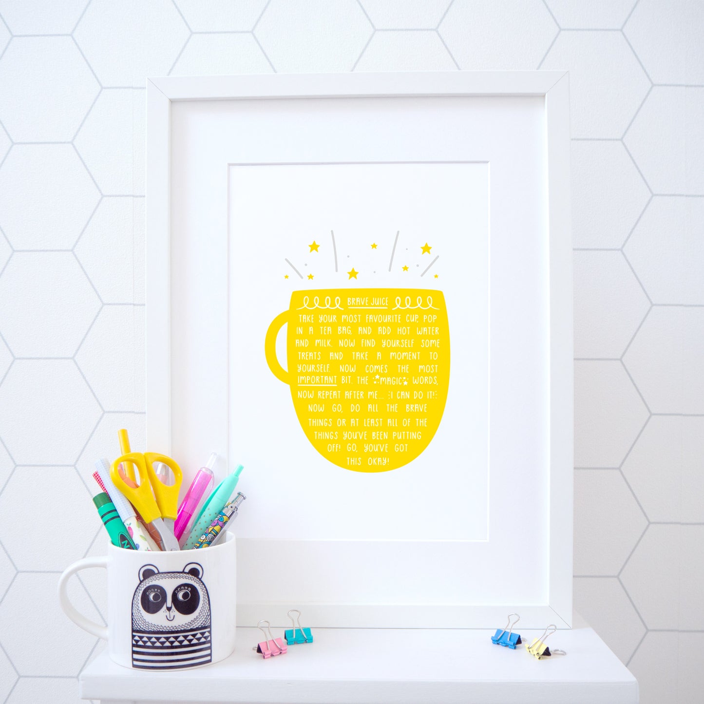 A cup of brave juice print in a happy bright yellow