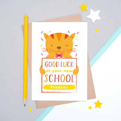 A good luck at your new school personalised card featuring an orange friendly cat sat on a grey and white background.