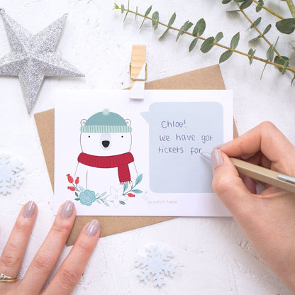 Personalised polar bear secret message Christmas scratch card being hand written.