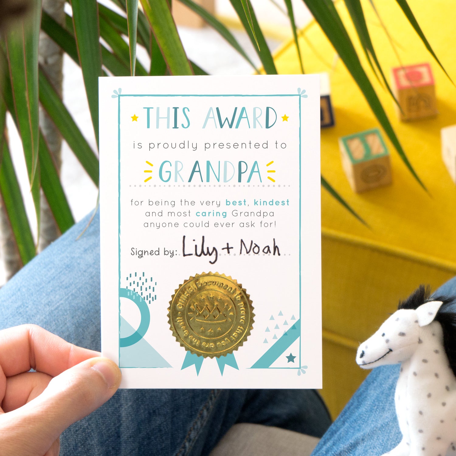 A Grandpa certificate award card printed onto white card in varying tones of blue and pops of yellow! Each card features a shiny gold seal to make it official!