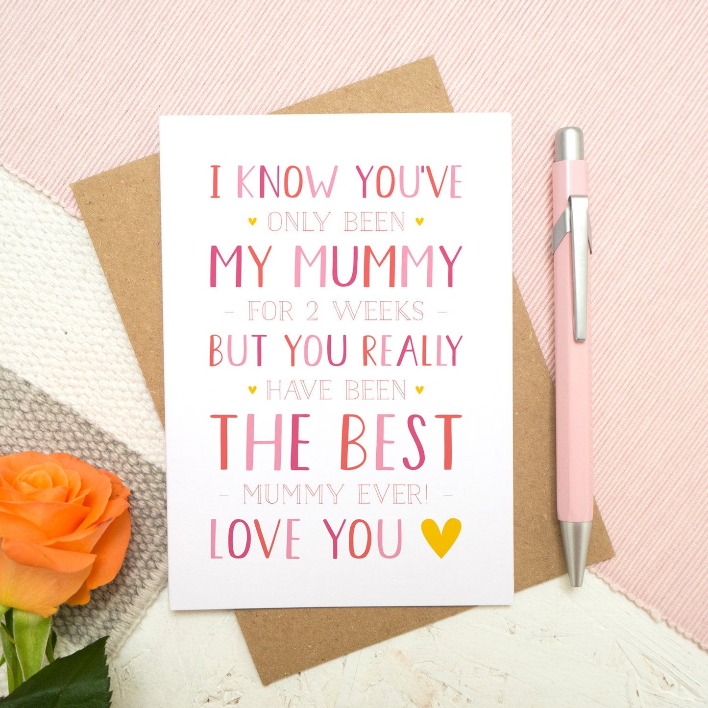 A personalised brand new mummy mother's day card, letting the mum know that she is the best and is loved! Set on a pink, white and grey background with a peach rose.