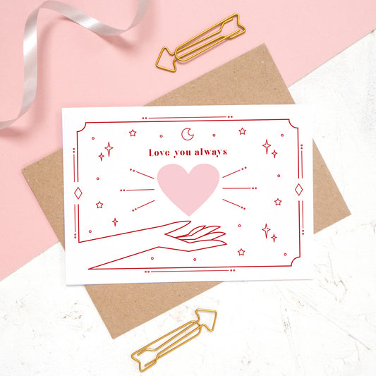 This card features the phrase 'love you always' with a heart and cosmic decor. A timeless classic for valentine's day.
