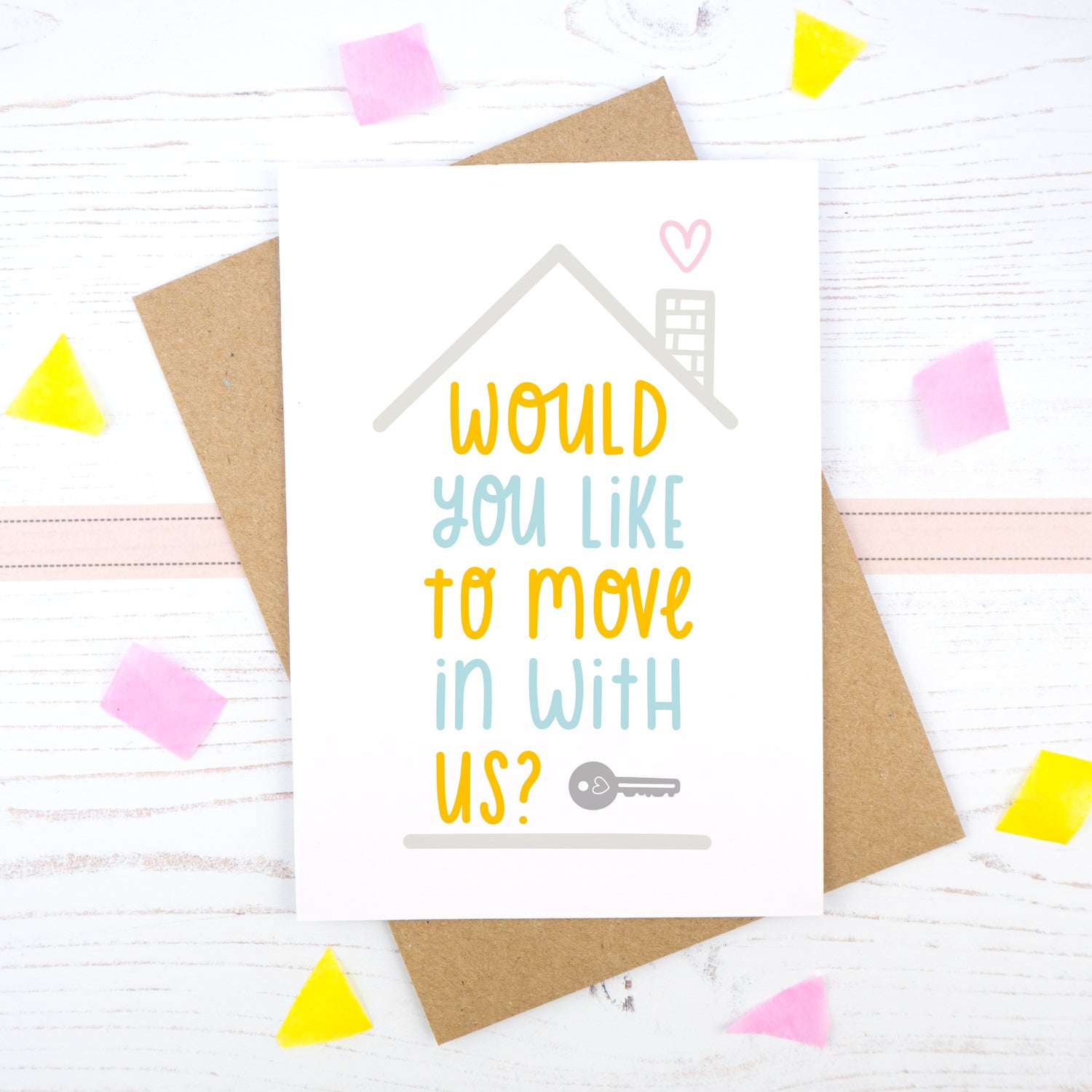 Would you like to move in with us card in blue and orange, under a grey roof and a dark grey key.