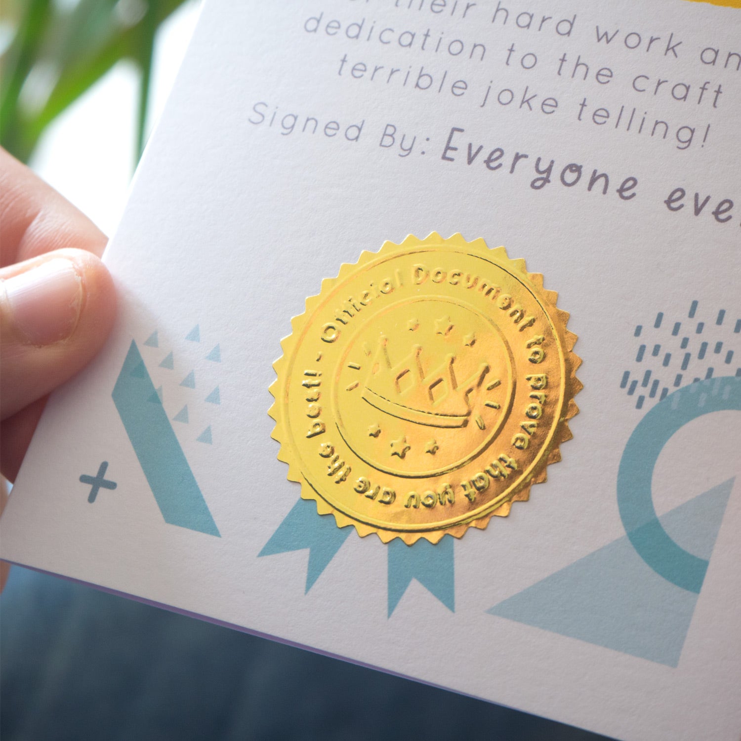 A close up of the gold shiny stamp!