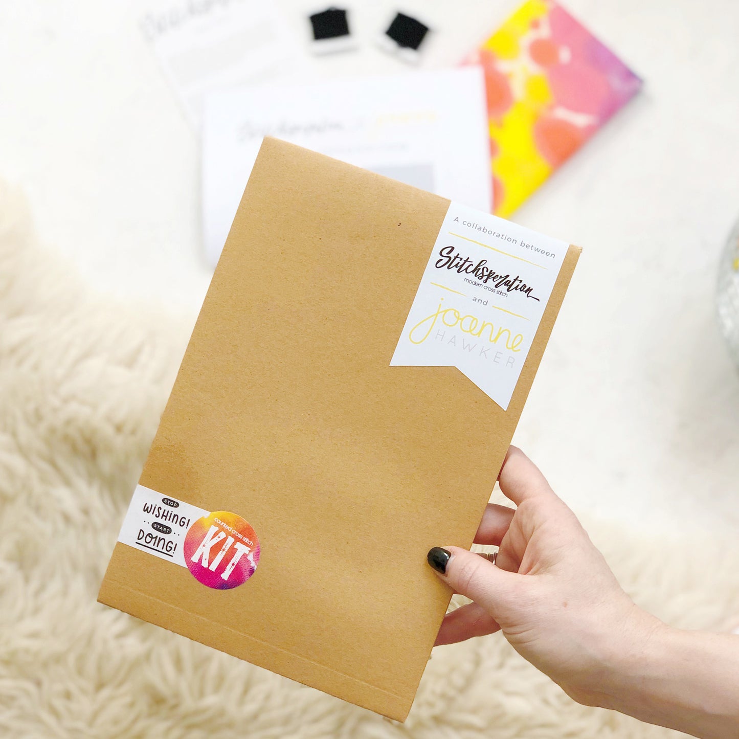 The stop wishing start doing collaboration kit comes packaged in a limited edition brown envelope.