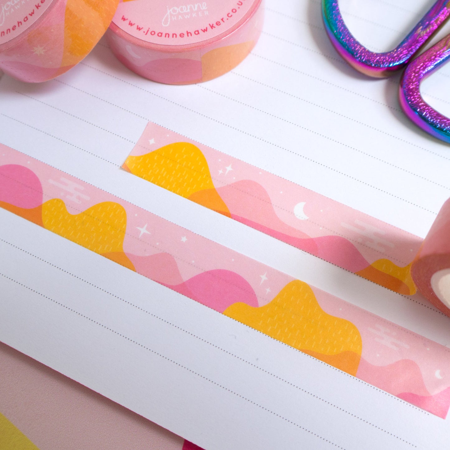 Strips of celestial desert mountain washi tape cut to size and stuck down in a white lined notebook.