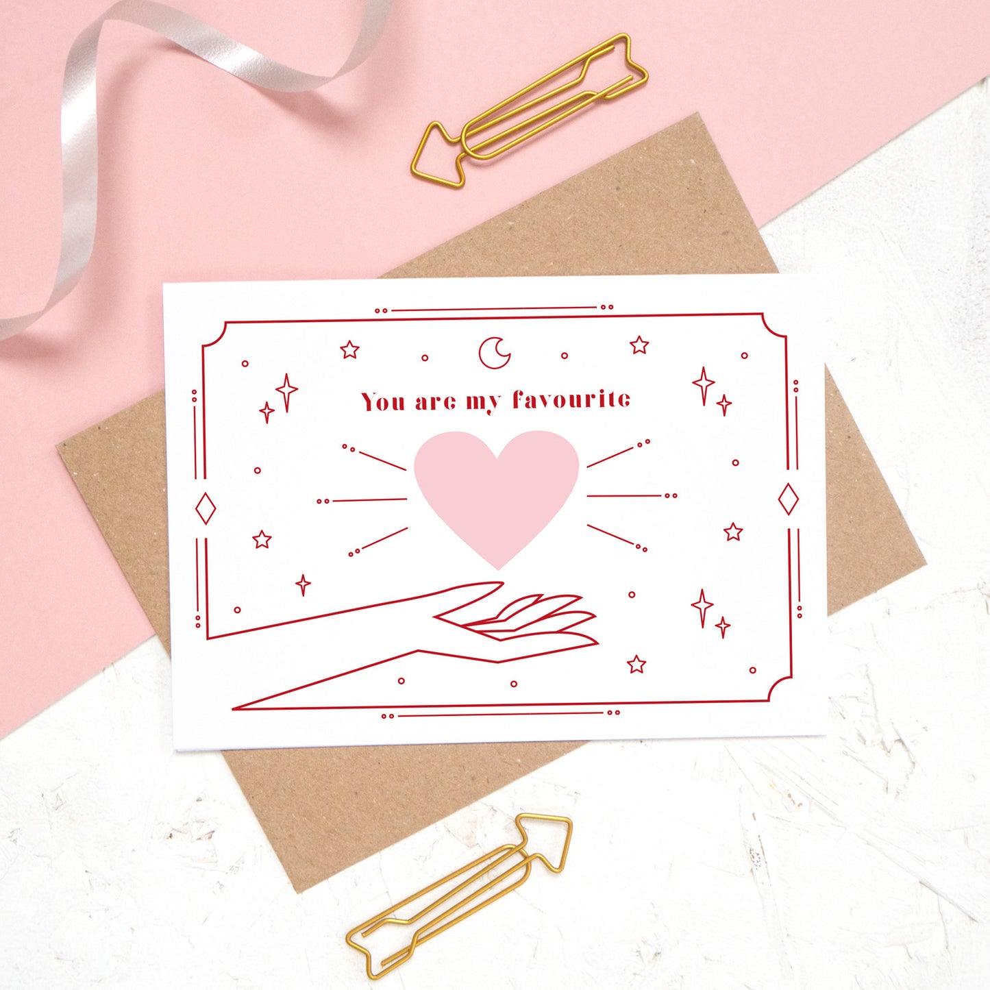 This card features the phrase 'you are my favourite' with a heart and cosmic decor.