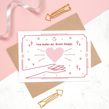 This card features the phrase 'you make my heart happy' with a heart and cosmic decor.