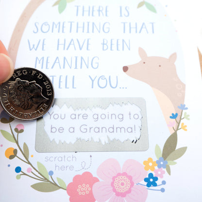 A baby announcement scratch card. New baby. You're going to be grandparents.